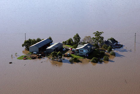 Australias worst flooding in 50 years is likely to affect its ability to harvest and export wheat and sugar.
